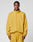 A man wears the LIVE FAST DIE YOUNG LFDY Trackjacket in an oversize fit, mustard yellow with reflective print, along with matching pants. He stands facing forward against a plain light gray background.