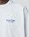 A close-up of the LIVE FAST DIE YOUNG LFDY Paris Tee in white Baumwolle shows Livé Fast™ PARIS, FRANCE in blue on the left chest. Only part of the neck and shoulder are visible, emphasizing its Oversize Fit.