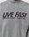 The LIVE FAST DIE YOUNG Live Fast Europe Run Sweater is a grey oversized sweatshirt with vintage wash, bold black LIVE FAST front print, and a smaller EUROPE RUN text across the chest.