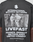 A close-up of the LFDY Grand Theft Tee by LIVE FAST DIE YOUNG shows a black-and-white image of two people with a motorcycle, “International Branch Network LIVEFAST” text, listed countries, and is made from 100% Baumwolle for everyday comfort.