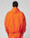 A person wearing the LIVE FAST DIE YOUNG Live Fast Trackjacket with reflektierender Druck and matching orange pants, seen from behind against a plain light background.