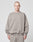 A person with a shaved head models the LIVE FAST DIE YOUNG Basic Blank Sweater in an oversize fit, light gray Baumwolle-Polyester blend, paired with matching pants, standing facing forward against a plain white background.