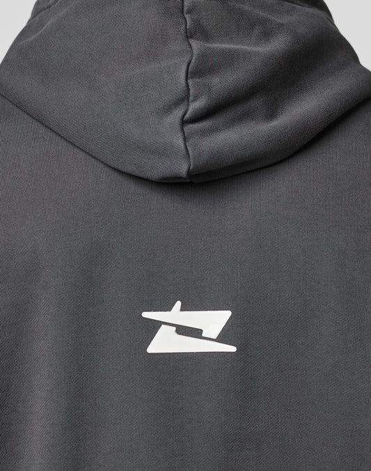 A close-up of the back of the dark gray LIVE FAST DIE YOUNG LFDY Core Hooded in Oversize Fit, featuring a white stylized geometric logo printed below the hood.