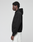 A person stands in profile against a plain background, wearing the LIVE FAST DIE YOUNG LFDY Grand Theft Hooded Zip in black, cotton oversize fit, and light pants. Their hands are relaxed at their sides.
