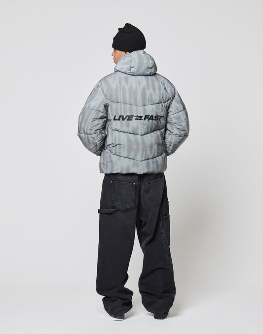 A person in a gray, water-repellent Live Fast Puffer Jacket by LIVE FAST DIE YOUNG, with "LIVE FAST" on the back, a black beanie, and loose black jeans stands facing away against a plain white background.
