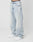 Person trägt die LFDY Baggy Denim von LIVE FAST DIE YOUNG aus 100% Baumwolle in Light-Wash-Optik mit Faded-Effekt und weitem, geradem Bein zu weißen Sneakern vor weißem Hintergrund. High-Waist-Schnitt, lockere Passform. Oberkörper nicht sichtbar.