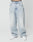 A person wears LIVE FAST DIE YOUNG’s LFDY Baggy Denim—light-wash, high-waisted, wide-leg jeans with a baggy fit made from 100% cotton—paired with white sneakers, standing against a plain white background. Only their lower half is visible.