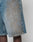 A close-up of a person wearing LFDY Tire Tracks Jorts from LIVE FAST DIE YOUNG—light blue, 100% Baumwolldenim shorts with a unique bleach pattern, visible seams, and a baggy fit for comfort and style.