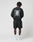 A person stands facing away, wearing a LIVE FAST DIE YOUNG Basic Evidence Sweater in oversize fit with front and back print, paired with black shorts, white socks, and white sneakers against a plain white background. Crafted from Baumwolle Polyester.