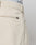 Close-up of the back of beige Wide Chino pants by LIVE FAST DIE YOUNG, in 100% cotton, showing a welt pocket with a black tag, part of a belt loop, and the waistband of LIVE FAST DIE YOUNG underwear visible at the top.