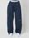 Someone wearing LFDY Active Fleece Jogger by LIVE FAST DIE YOUNG in navy blue with black seam details, a visible LIVE FAST logo waistband, and white sneakers, standing against a plain light background.