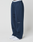 Person wearing LFDY Active Fleece Jogger by LIVE FAST DIE YOUNG—wide fit navy sweatpants made from soft Baumwolle with side zip pocket, curved seams, LIVE FAST logo on thigh, white waistband, and white sneakers—standing against a light background.
