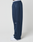 A person in wide fit navy LFDY Active Fleece Jogger by LIVE FAST DIE YOUNG, featuring black seam details, zippered pocket, and a small LIVE FAST logo near the knee, styled with white sneakers and posed sideways against a white background.