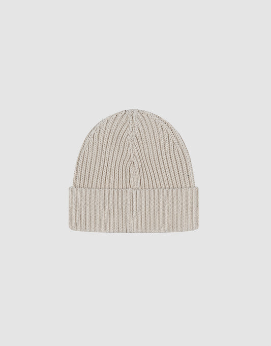 The LIVE FAST DIE YOUNG Double Rib Knit Beanie in beige features a folded brim, double-layer ribbed knit for extra warmth, and a voluminous look, shown on a plain white background.