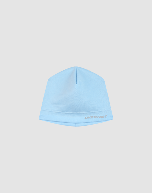 The Live Fast Performance Beanie by LIVE FAST DIE YOUNG features a light blue color and "LIVE FAST" in small white letters near the bottom, showcased against a plain light gray background.
