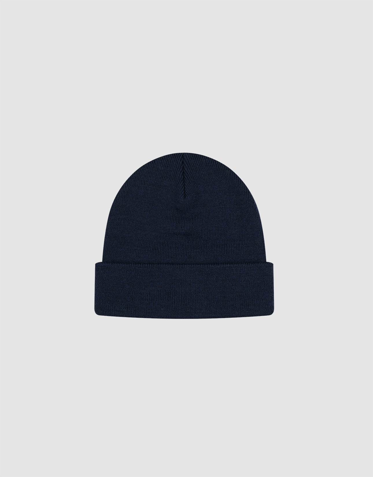 The LIVE FAST DIE YOUNG Basic Beanie is a one-size, dark navy knit hat with a folded brim and soft polyacryl fabric, featuring a subtle flaglabel detail. Displayed on a light gray background.