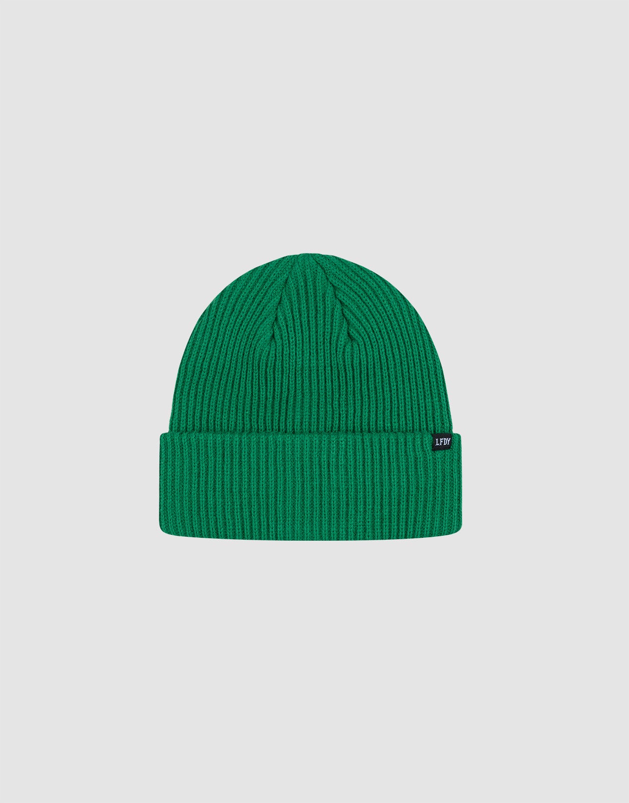 The Double Rib Knit Beanie by LIVE FAST DIE YOUNG is bright green, doppellagig gestrickt, with a folded cuff and small black side tag, offering a voluminöser Look against a plain light gray background.
