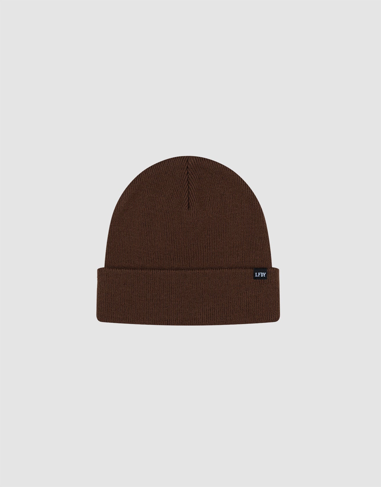 The LIVE FAST DIE YOUNG Basic Beanie is a brown, one size knit hat featuring a folded brim and black flag label, made from soft polyamide and shown on a light gray background.