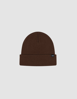 The LIVE FAST DIE YOUNG Basic Beanie is a brown, one size knit hat featuring a folded brim and black flag label, made from soft polyamide and shown on a light gray background.