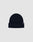 The LIVE FAST DIE YOUNG Basic Beanie is a plain, dark navy knit with a folded brim and a small rectangular flag-label featuring subtle text, shown against a light grey background.