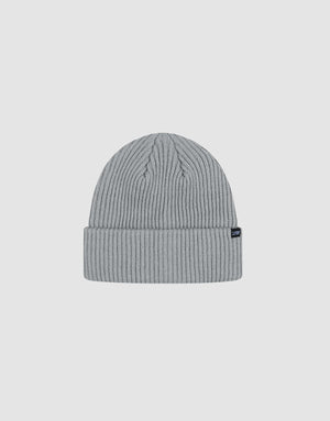The LIVE FAST DIE YOUNG Rib Knit Beanie in light gray polyacryl features a folded cuff with a small black tag, shown on a white background. This stylish one-size beanie offers cozy comfort and modern flair.