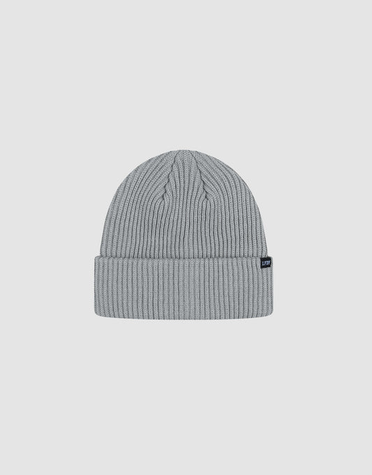 The LIVE FAST DIE YOUNG Rib Knit Beanie in light gray polyacryl features a folded cuff with a small black tag, shown on a white background. This stylish one-size beanie offers cozy comfort and modern flair.