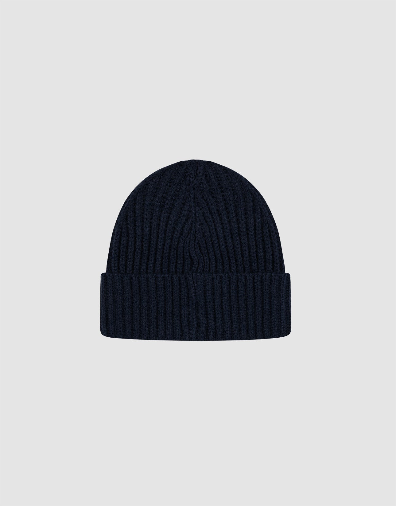 A navy Rib Knit Beanie from LIVE FAST DIE YOUNG, crafted in Polyacryl with a wide folded cuff, shown on a plain light grey background. One size fits most for versatile wear.