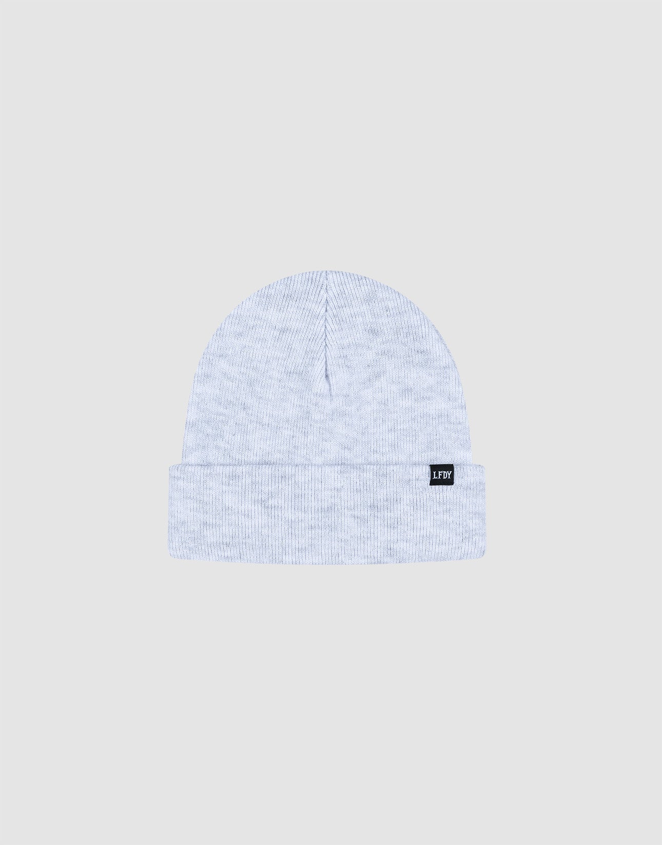 The LIVE FAST DIE YOUNG Basic Beanie is a light gray ribbed knit polyacryl one size beanie with a folded brim and a small black flaglabel with white text on the left, shown against a plain light gray background.