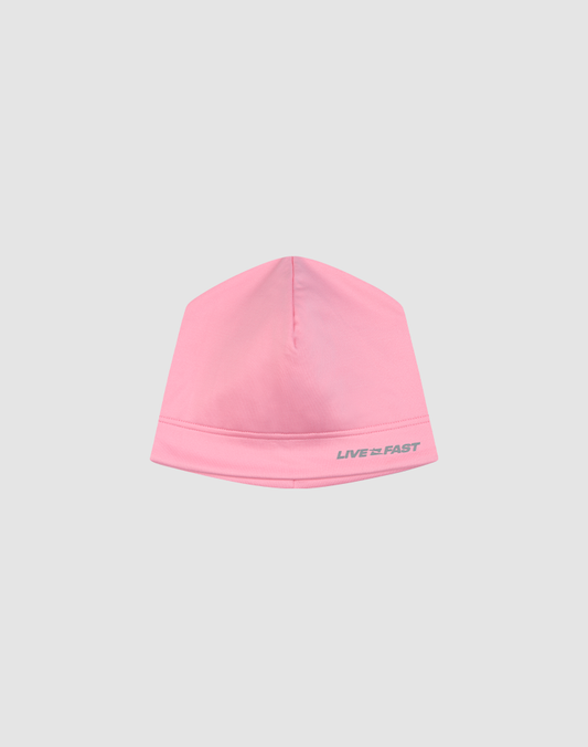 A light pink Performance Beanie by LIVE FAST DIE YOUNG, featuring a subtle gray LIVE FAST logo on the front and made from a soft polyester-elastane blend, shown on a plain light gray background.