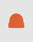 The LIVE FAST DIE YOUNG Basic Beanie is a plain orange polyacryl knit with a folded cuff and subtle flaglabel, shown on a light gray background. This one-size beanie delivers comfort and style for daily wear.