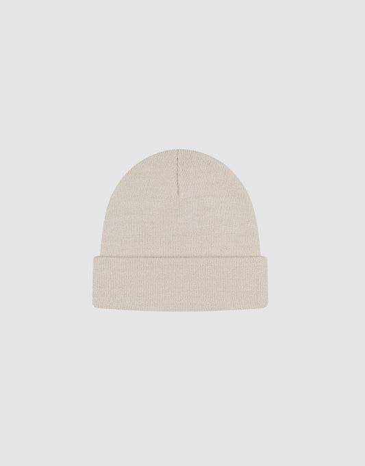 The LIVE FAST DIE YOUNG Basic Beanie is a plain, light beige polyacryl knit with a folded brim and subtle flag label. One size. Shown on a white background.