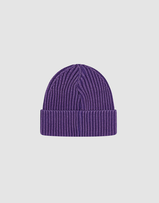A purple Washed Rib Knit Beanie by LIVE FAST DIE YOUNG, made from 100% Baumwolle with a wide folded brim. Displayed on a plain light gray background. One Size for comfortable everyday wear.