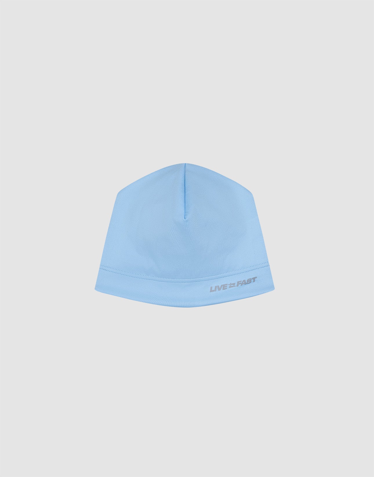 The Live Fast Performance Beanie by LIVE FAST DIE YOUNG features a light blue fitted design with "LIVE FAST" in small gray text near the edge, shown against a plain white background.