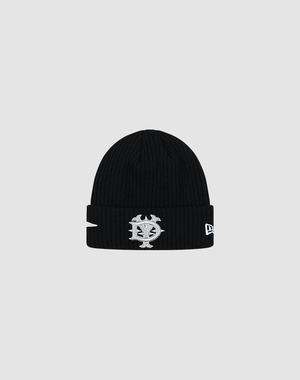 The LFDY x New Era Beanie by LIVE FAST DIE YOUNG is a black ribbed knit beanie with a folded brim, embroidered silver and white face logo, and New Era Flag on the front. Shown against a light gray background.