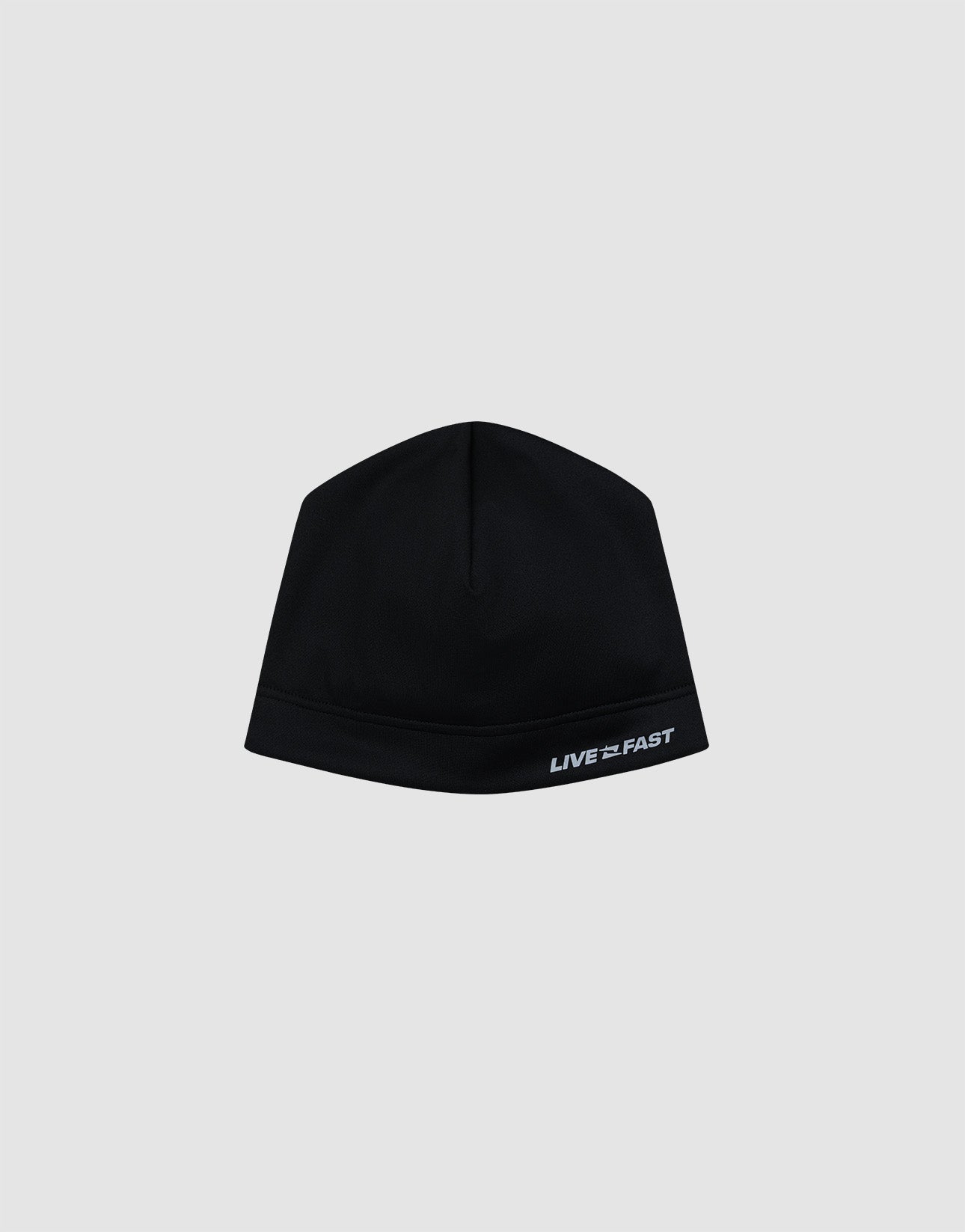 The Live Fast Performance Beanie by LIVE FAST DIE YOUNG is a fitted black beanie with a thin fleece lining and "LIVE FAST" in white on the lower right, shown against a plain light gray background.| plain 