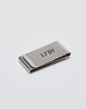 The Basic Money Clip by LIVE FAST DIE YOUNG, made of stainless steel (Edelstahl) with a LFDY engraved logo, Modellnummer LF2305-13597, is displayed on a plain white background.