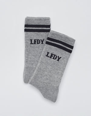 A 2-pack of gray Basic Socks by LIVE FAST DIE YOUNG, featuring black stripes near the top and LFDY lettering. Displayed on a white background. Easy-care and comfortable for everyday wear.