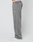 A person stands sideways in LIVE FAST DIE YOUNG’s Basic Wide Jogger—oversized grey sweatpants with a subtle logo print—paired with white sneakers and a visible LIVE FAST waistband, all set against a plain white background.