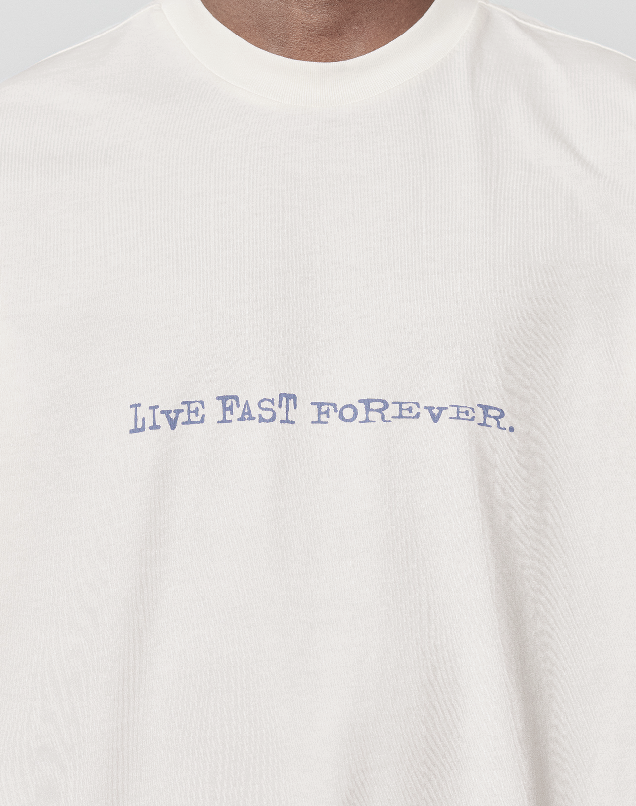 The LFDY We Walked Tee by LIVE FAST DIE YOUNG is a white, oversize-fit t-shirt made from 100% cotton, with "LIVE FAST FOREVER." in blue, slightly distorted text on the chest.