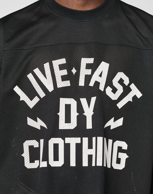 A close-up of the LFDY Flash Jersey by LIVE FAST DIE YOUNG—a black mesh oversized shirt with bold white LIVE FAST DY CLOTHING front print, accented by lightning bolts. Crafted from breathable polyester for comfort and style.