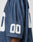 A close-up of the LFDY Mesh Jersey by LIVE FAST DIE YOUNG in navy blue polyester mesh, featuring an oversize fit and white 00 on the sleeve. The wearer’s arm is shown against a plain background.