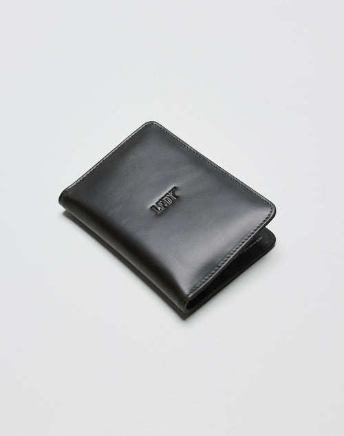 A black LFDY Passport Case by LIVE FAST DIE YOUNG with card slots and ADAY embossed on the front, shown on a plain white surface.
