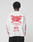A person with short, twisted hair faces away in an oversized white LIVE FAST DIE YOUNG LFDY We Walked Longsleeve, 100% Baumwolle, featuring red flame graphics and “WE WALKED SO THEY CAN RUN” on the back. Background is plain light gray.