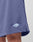 Close-up of a person wearing blue Basic Mesh Shorts by LIVE FAST DIE YOUNG, featuring an elastic waistband and a small logo patch near the hem. Focus is on the mesh texture, regular fit, and brand logo on the lower left side.