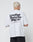 A person with short blond hair wears a white oversize Basic 280 Tee by LIVE FAST DIE YOUNG, featuring bold black backprint text and smaller text below, made from 100% cotton, standing against a plain white background.