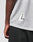 A close-up of a person wearing the LIVE FAST DIE YOUNG LFDY Mesh Jersey in light gray, featuring a white triangle L logo near the hem, paired with black mesh shorts. The persons left arm is visible.