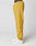 A person in LIVE FAST DIE YOUNG LFDY Trackpants—mustard yellow with Elastikbund and reflective Live Fast print—stands sideways in white sneakers against a plain white background, showing only the lower body.