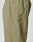 Close-up of the Live Fast Trackpants by LIVE FAST DIE YOUNG in light olive green, showcasing a zippered side pocket, reflective logo print, piping along the seams, and an elastic drawcord waist against a plain background.