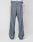 A person is shown from the back wearing LIVE FAST DIE YOUNG LFDY DY Trackpants in a wide fit blue design with light gray side panels and a visible white elastic waistband, standing against a plain light background.