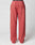 The LIVE FAST DIE YOUNG Live Fast Sweatsuit Jogger is a pair of loose-fitting, coral pink sweatpants with an Elastik-Bund waistband, back pocket, and oversize fit, shown on a plain white background.